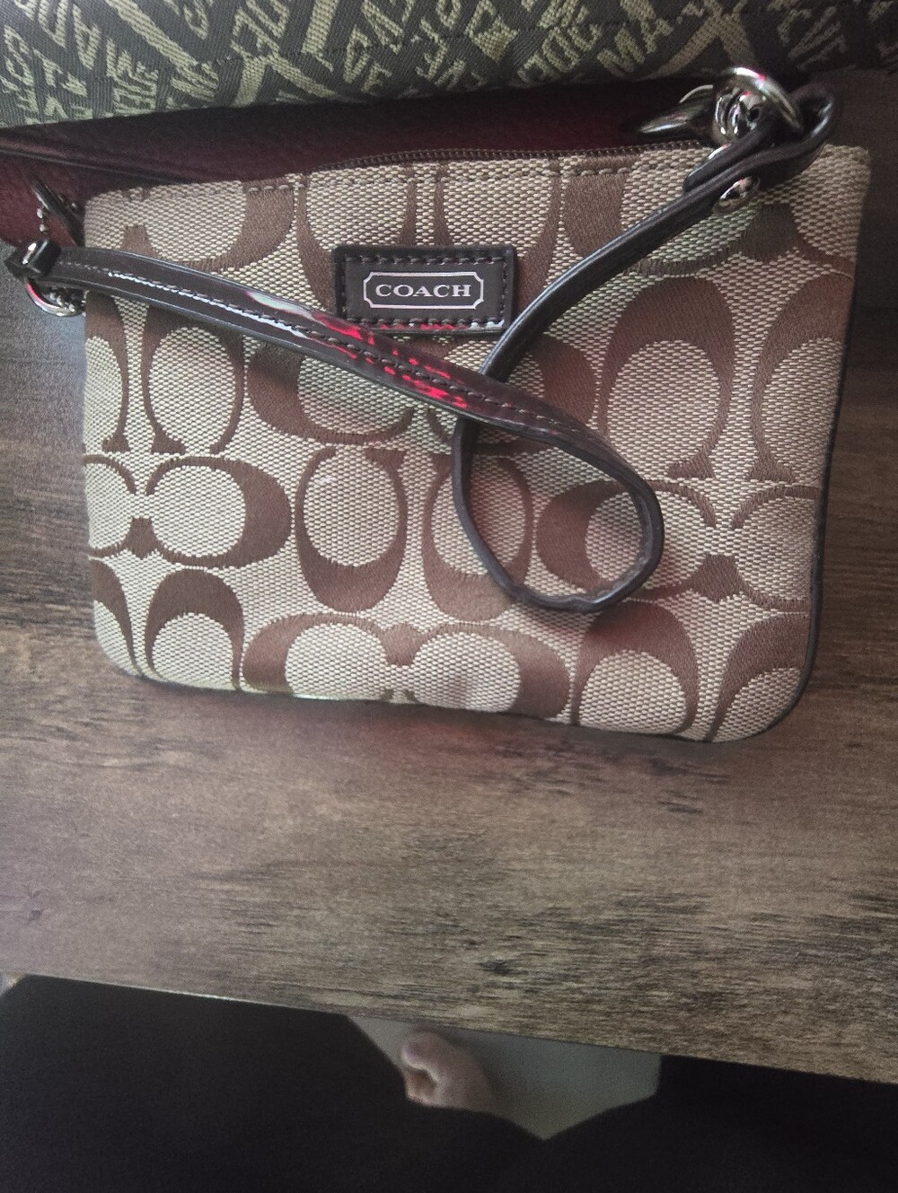 COACH Brown Signature Canvas Wristlet with Dark Brown Leather Strap